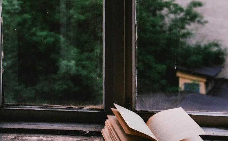 book near glass window