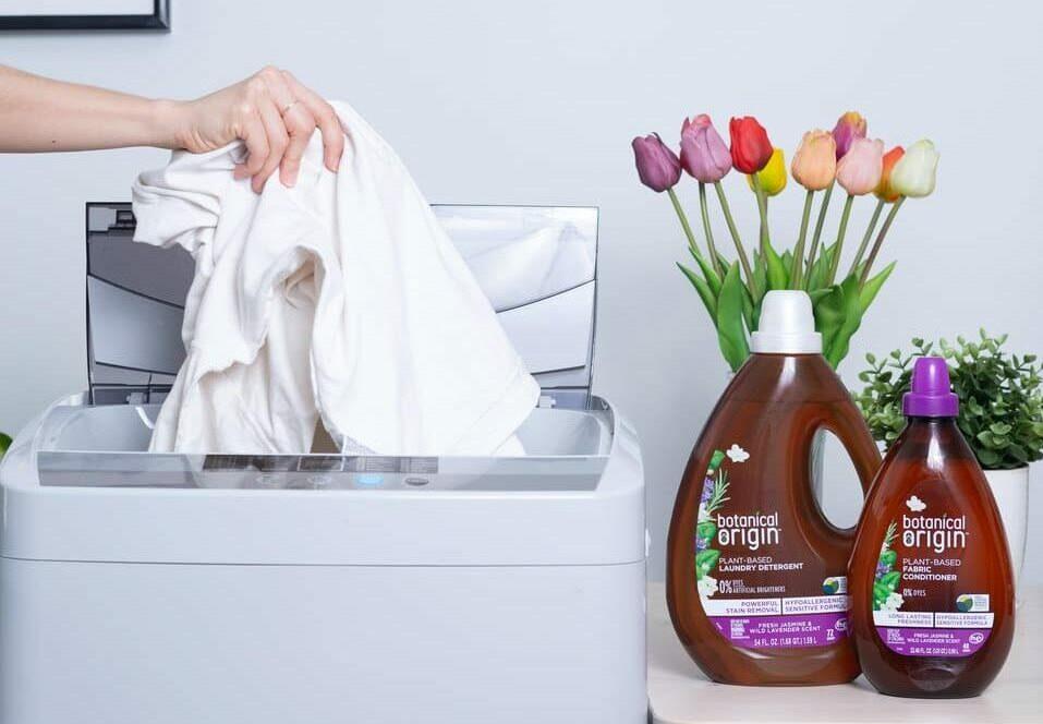 person holding brown plastic bottle