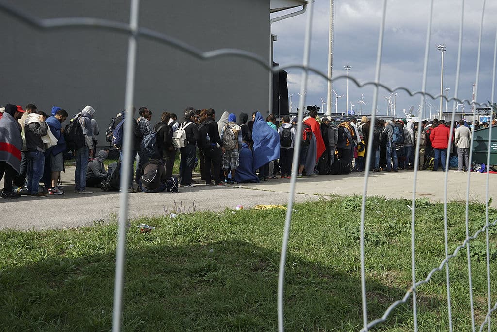 A line of Syrian refugees crossing the border of Hungary and Austria on their way to Germany. Hungary, Central Europe, 6 September 2015