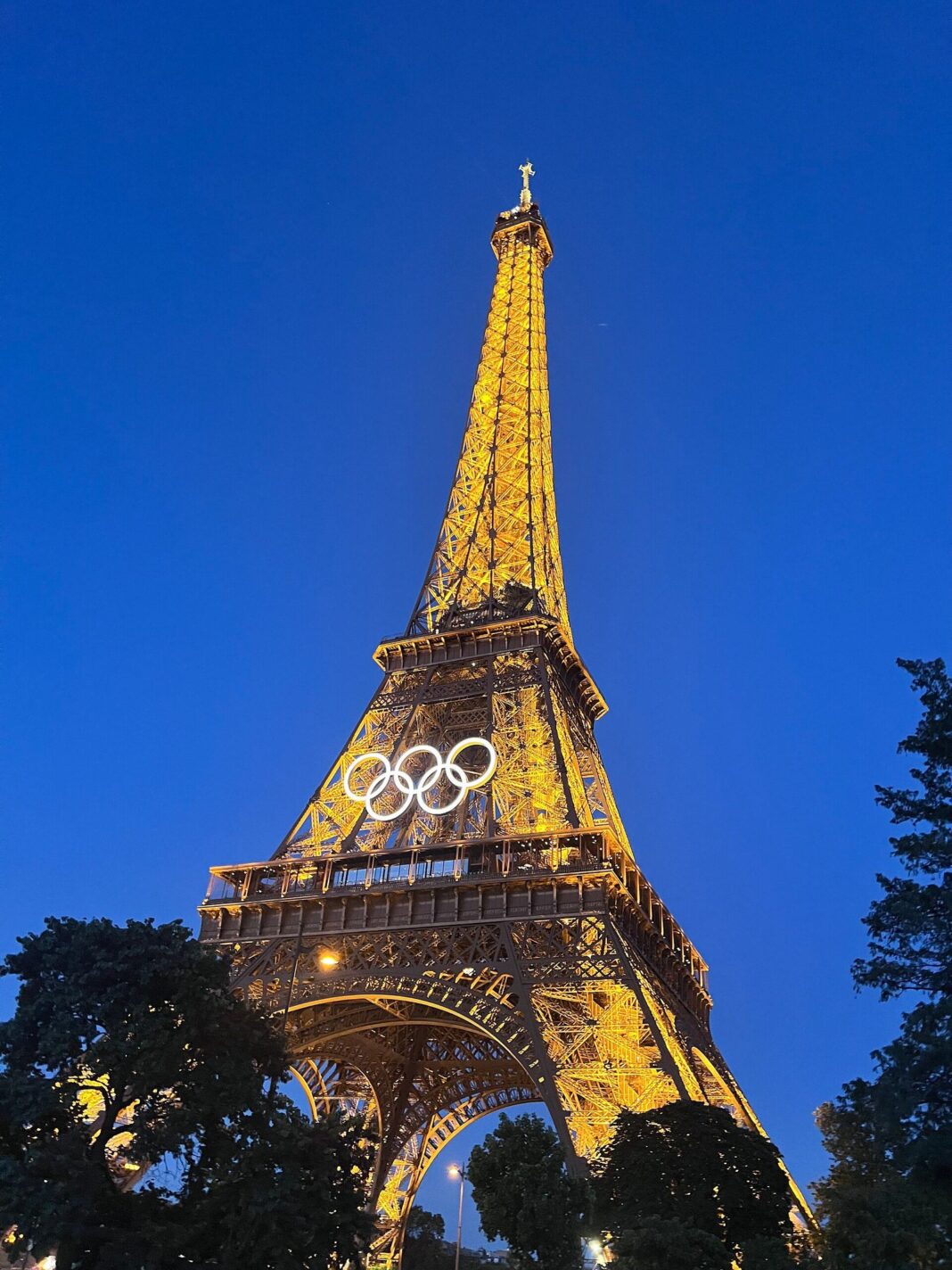 Eiffel Tower with Olympic rings at night